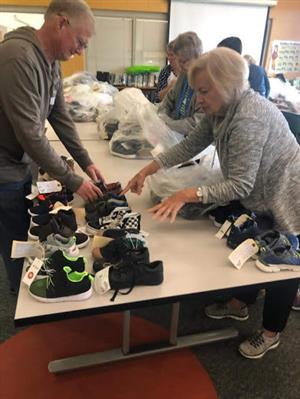 organizing shoes on a table 
